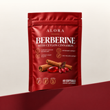 Alora Berberine with Ceylon Cinnamon 60-softgel pouch on a crimson plinth