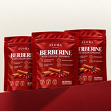 Three Alora Berberine with Ceylon Cinnamon pouches on a crimson plinth
