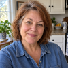Woman in a denim shirt, head-and-shoulders portrait