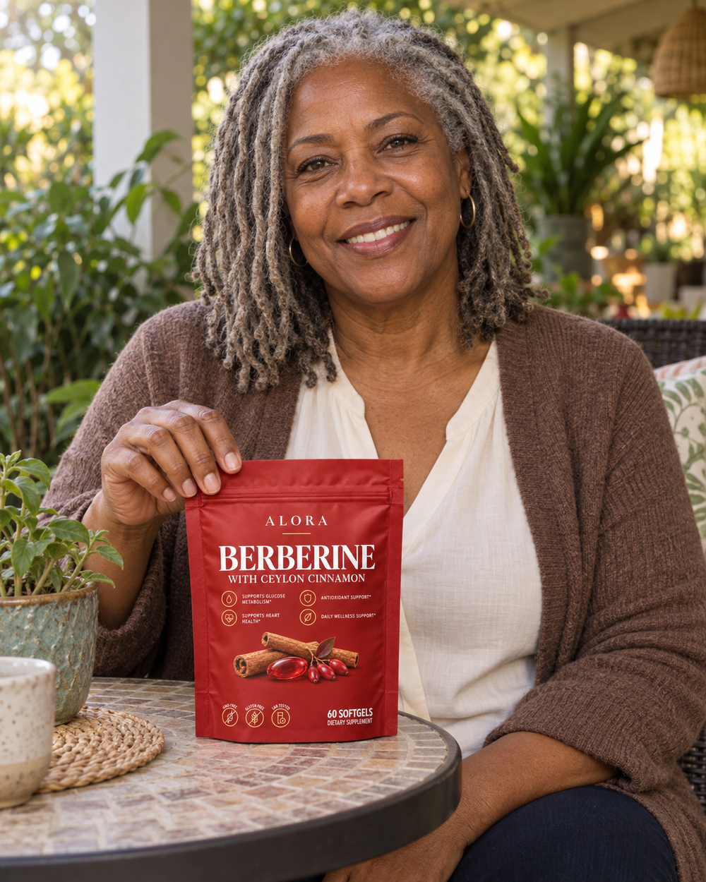 Alora lifestyle portrait with a red Berberine pouch